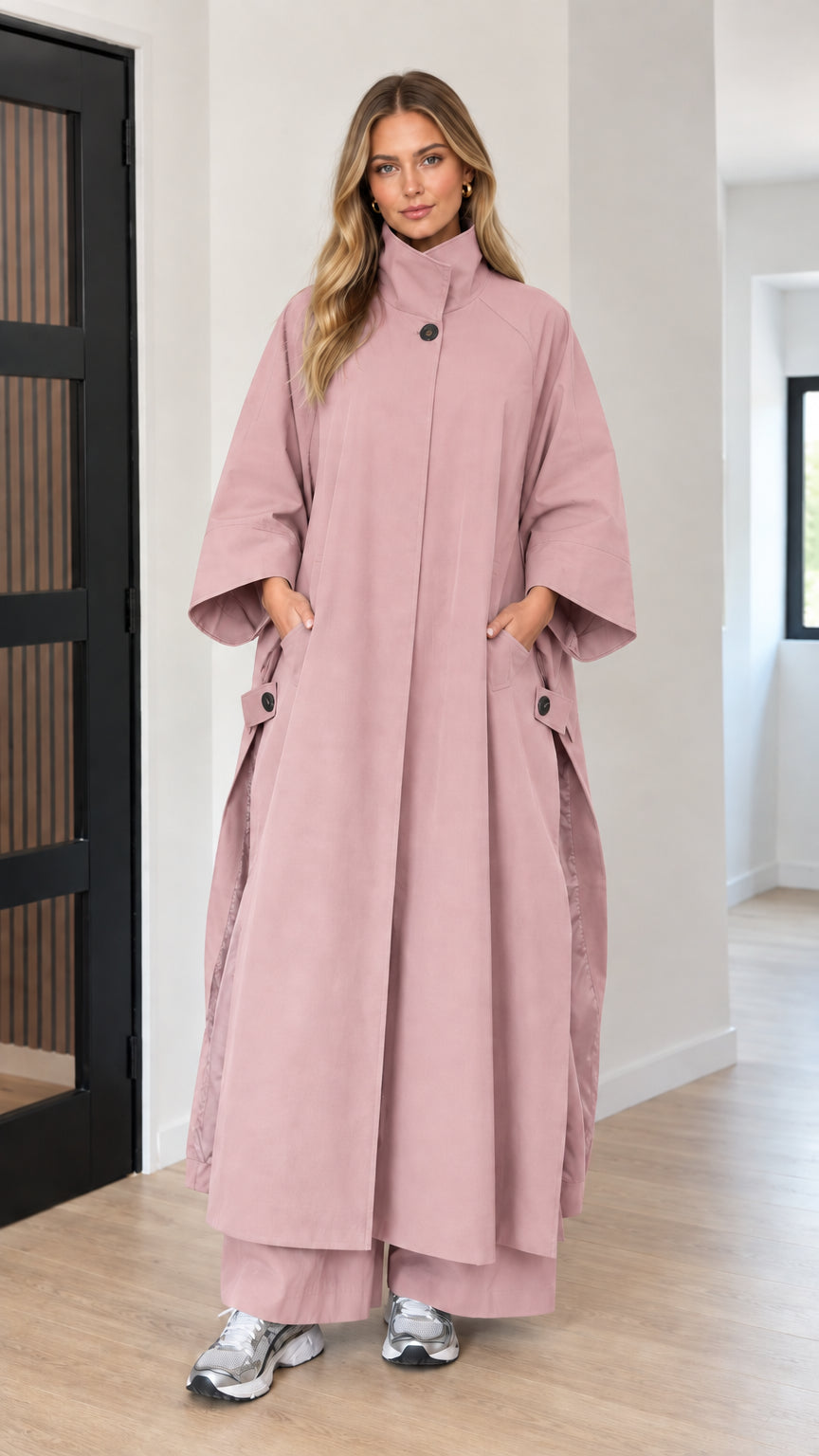 Front full-length view of woman wearing dusty pink oversized maxi cape coat