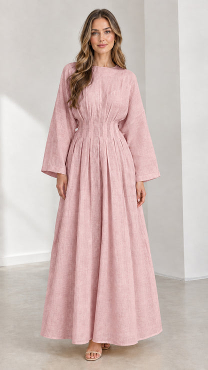 Front view of woman wearing Dusty Pink pleated waist long sleeve maxi dress