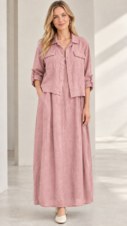 Model wearing dusty pink button-up jacket and flowing maxi skirt set