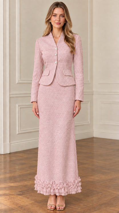 Front view of model wearing blush pink tweed blazer and maxi skirt two-piece suit set
