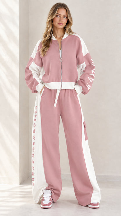 Full front view of model wearing dusty pink and white colorblock zip-up tracksuit set
