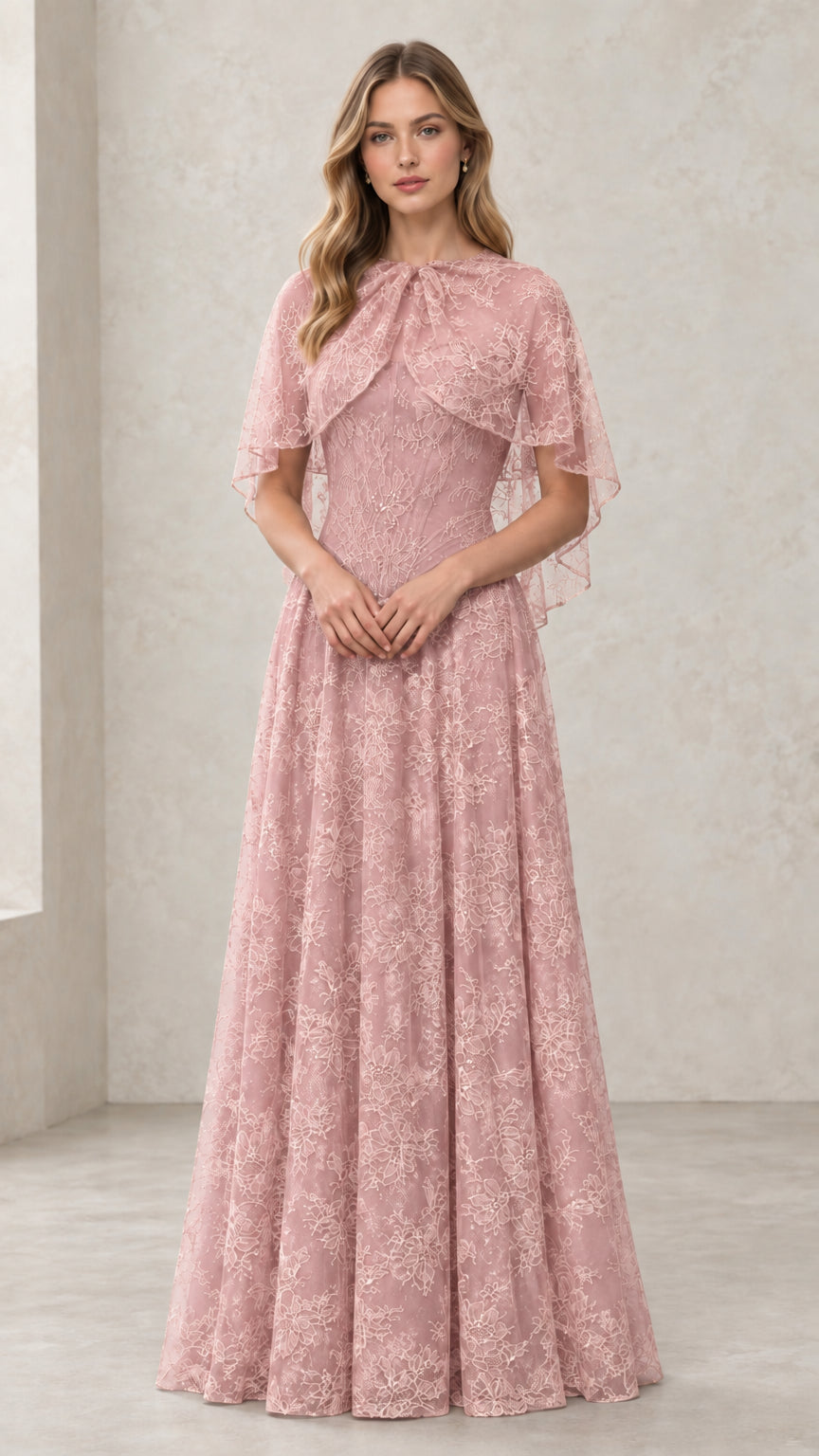 Woman wearing Dusty Rose embroidered lace capelet evening dress