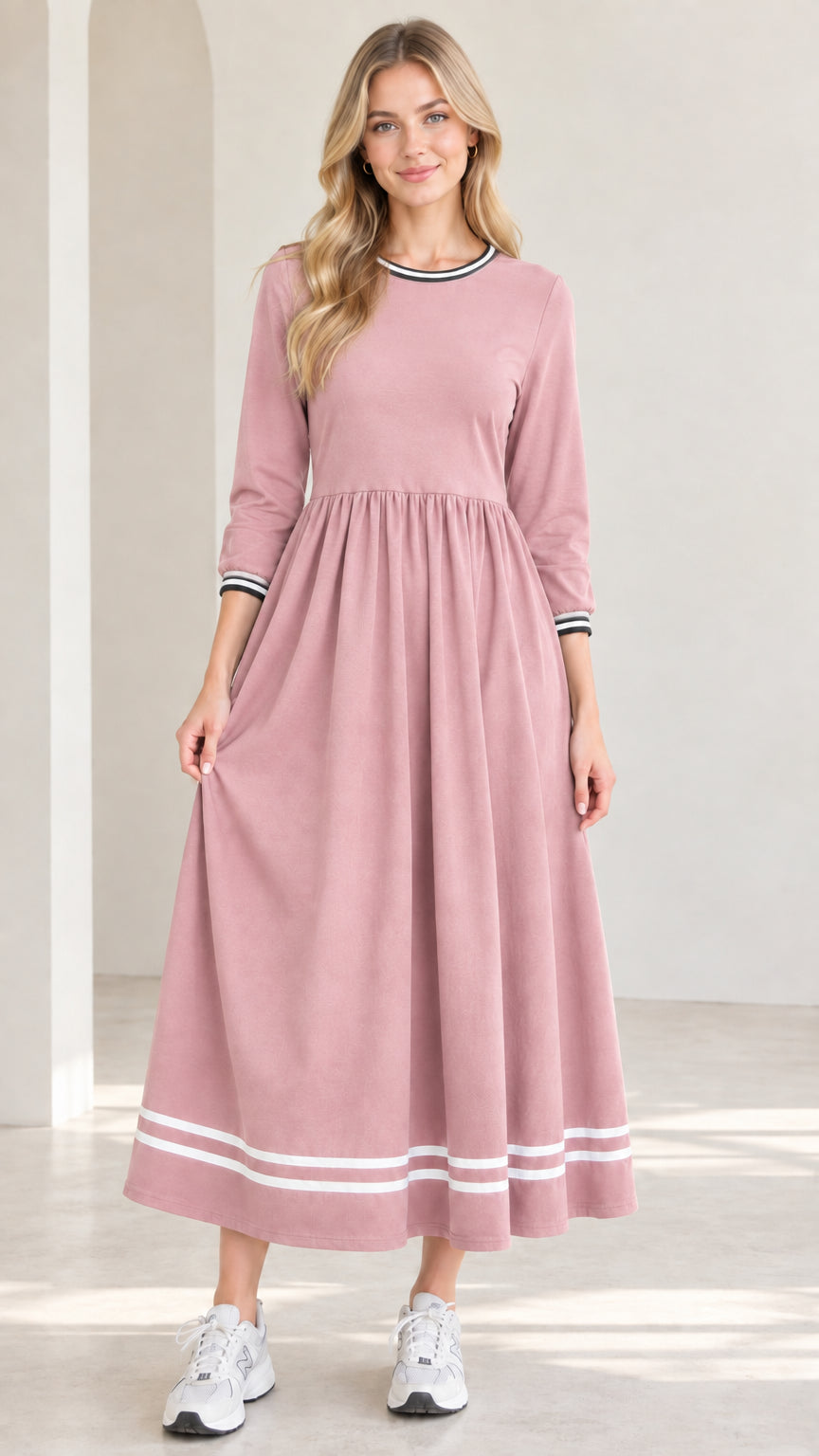 Front view of model wearing dusty pink 3/4 sleeve maxi dress with white striped trim