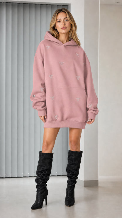 Full-length view of pink rhinestone bow oversized hoodie dress