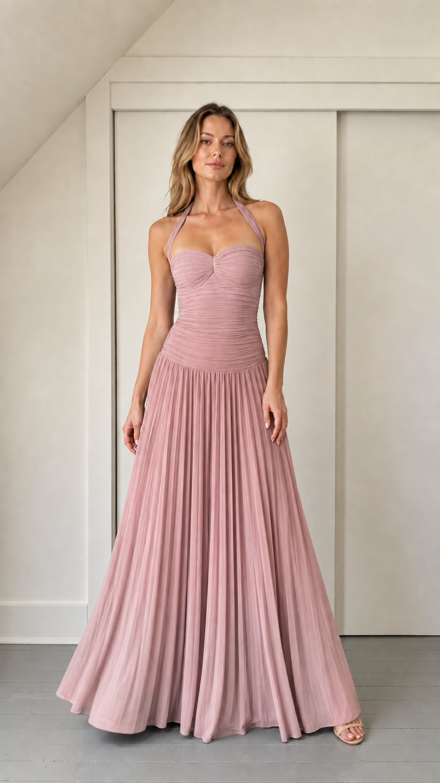Model wearing dusty rose ruched halter maxi dress