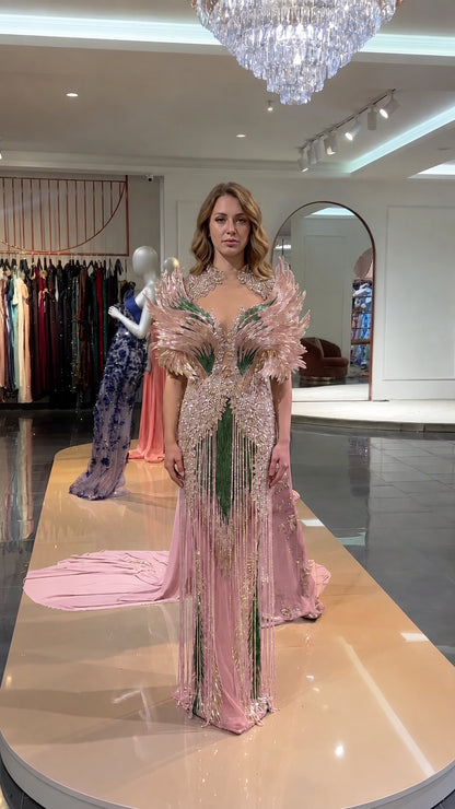 Front view of blush pink and gold beaded feather mermaid gown