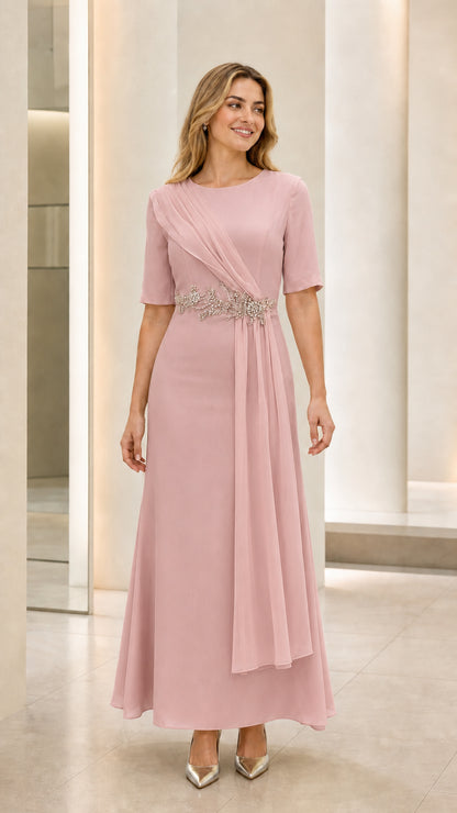 Front view of model wearing dusty pink draped evening maxi dress with beaded waist