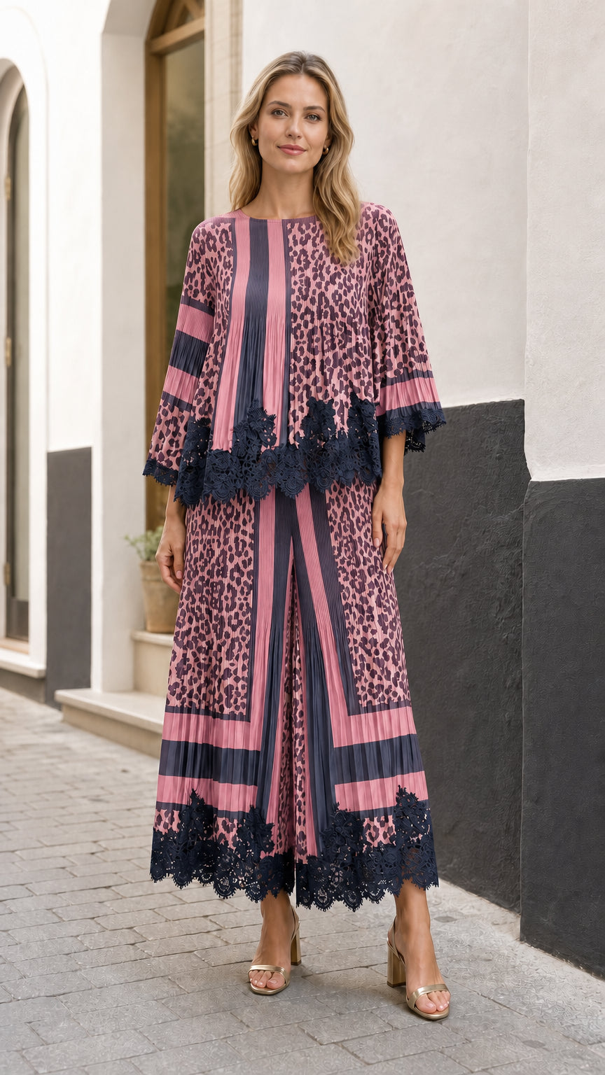 Full front view of model wearing the mauve pink and navy pleated leopard two-piece set