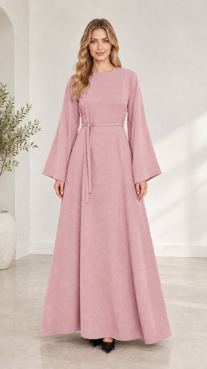 Full-length front view of woman wearing dusty pink long bell sleeve modest maxi dress