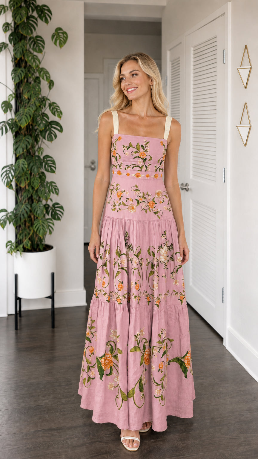 Front view of model wearing dusty pink floral embroidered tiered maxi dress