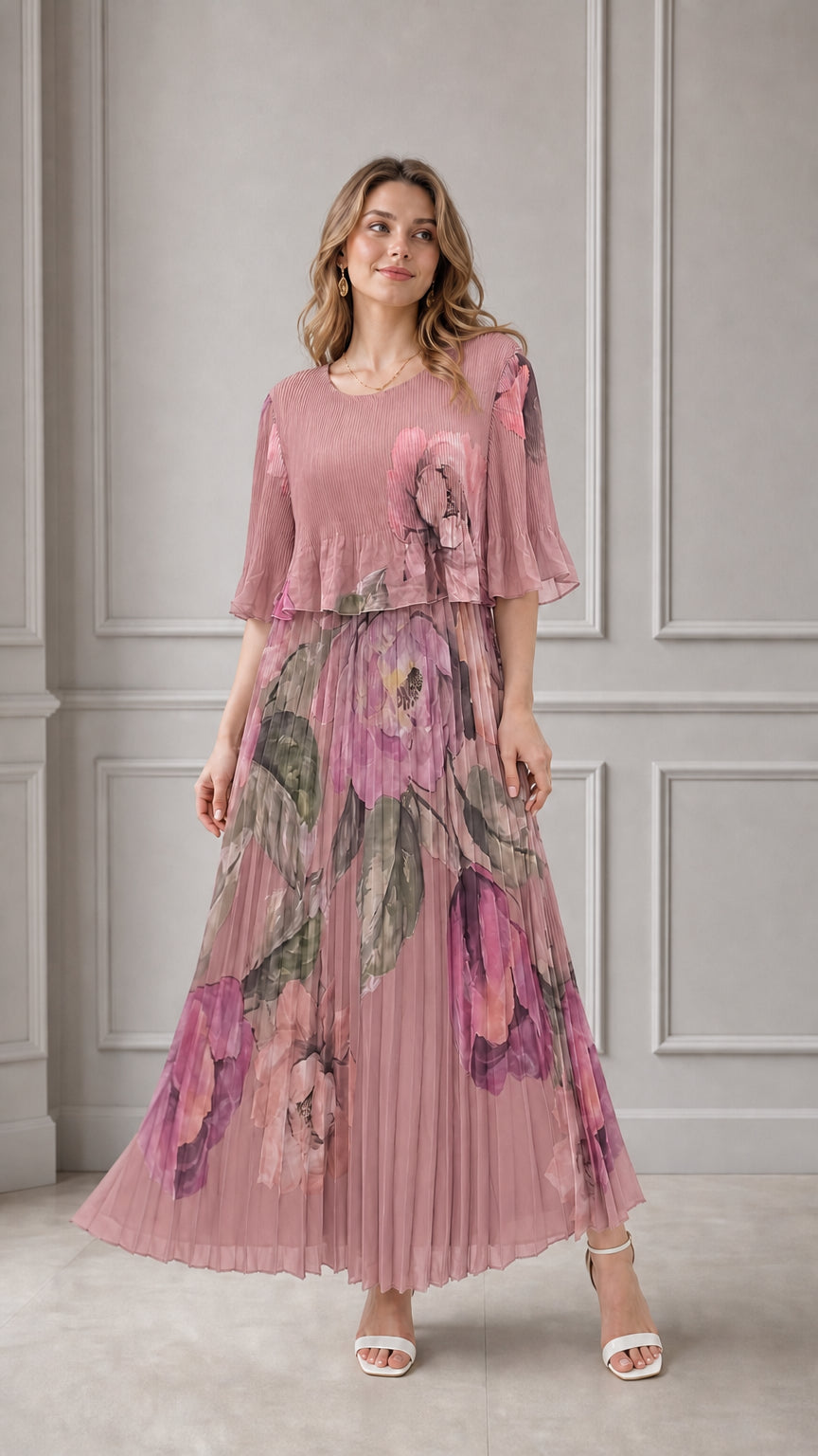 Model wearing dusty pink floral pleated maxi dress with flutter sleeves