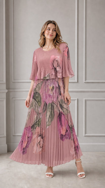 Model wearing dusty pink floral pleated maxi dress with flutter sleeves
