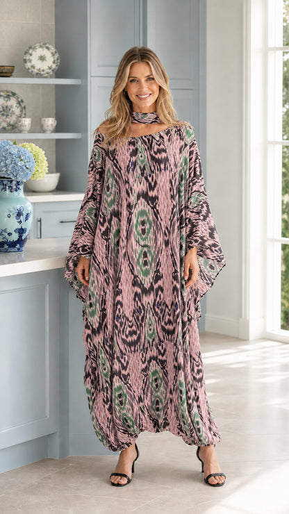 Front full view of woman wearing dusty pink Ikat print kaftan maxi dress
