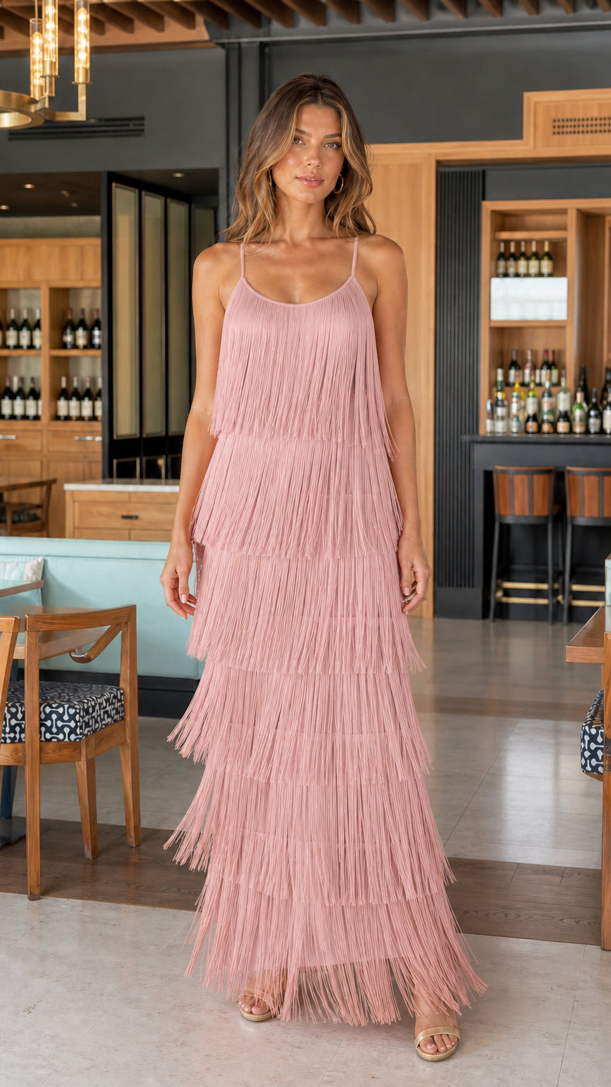 Model wearing soft pink tiered fringe maxi dress