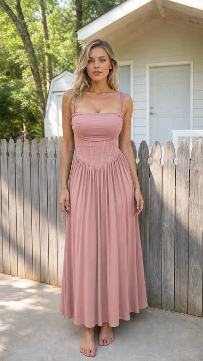 Front view of woman wearing dusty pink corset cami maxi dress