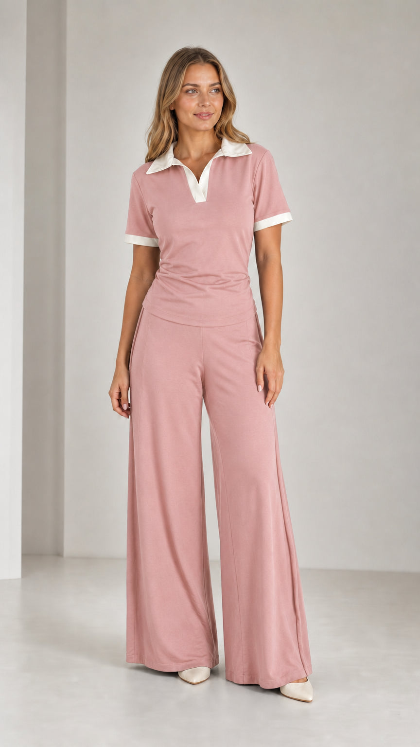 Model wearing Dusty Pink contrast collar polo top and relaxed wide-leg trousers