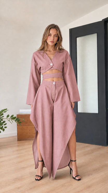 Model wearing dusty pink two-piece crop top and skirt set