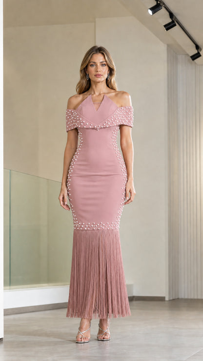 Model wearing dusty pink off-the-shoulder pearl embellished fringe evening dress