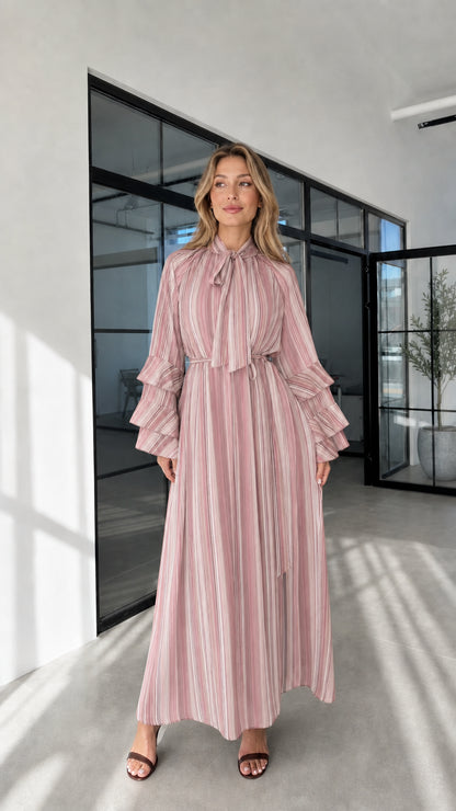 Model wearing pink striped ruffle sleeve maxi dress front view