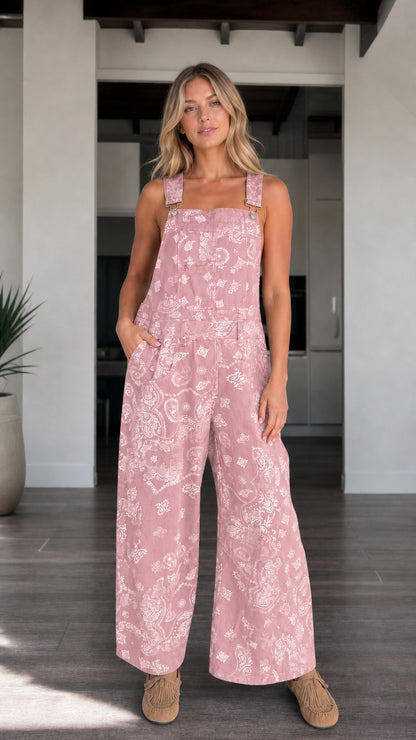 Front view of woman wearing Dusty Pink paisley print wide-leg overalls