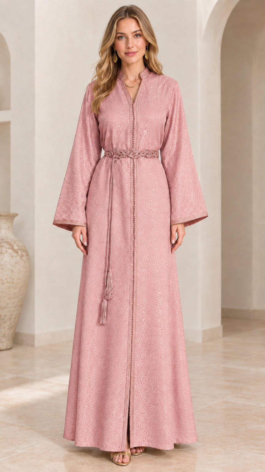 Front full view of woman wearing Blush Pink textured kaftan gown with waist tie