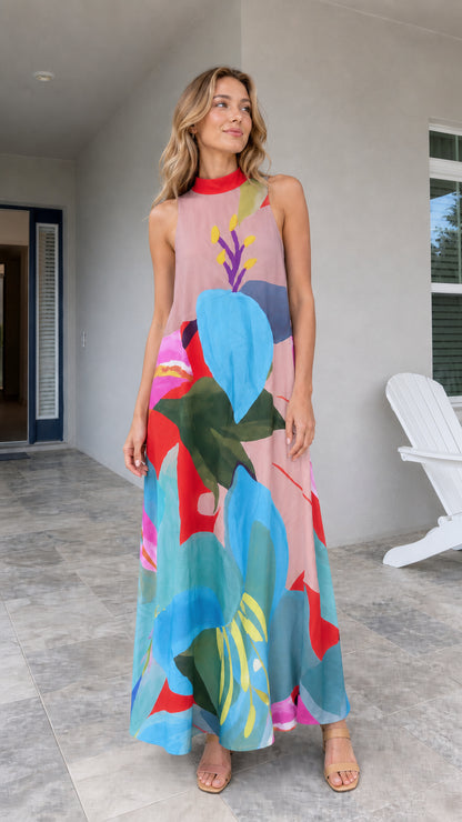 Model wearing pink tropical print maxi dress