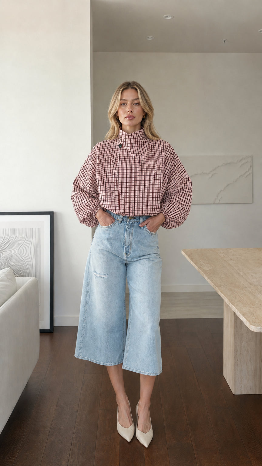 Model wearing pink plaid high-neck blouse