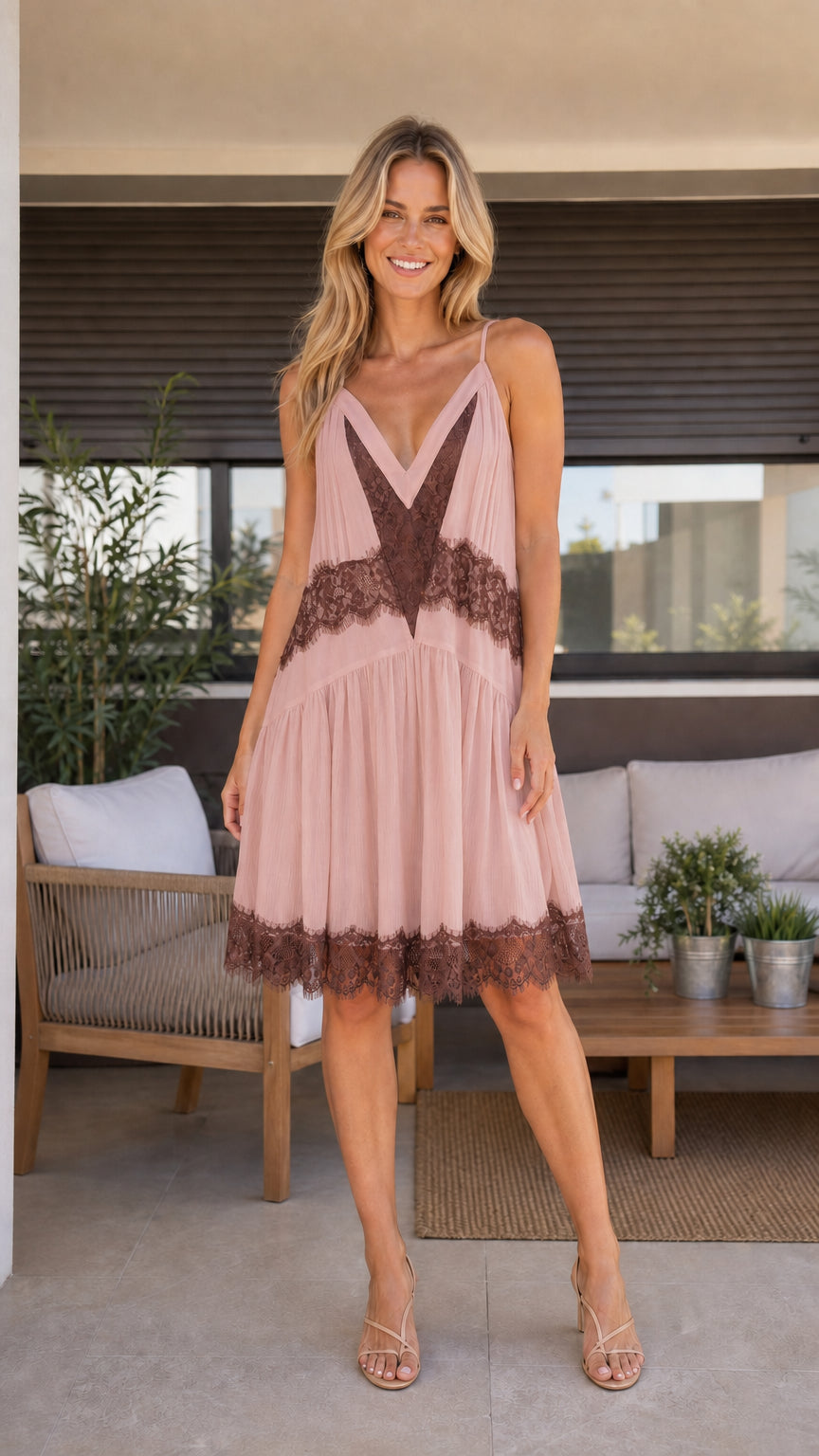Front view of blush pink babydoll cami dress with contrast brown lace trim