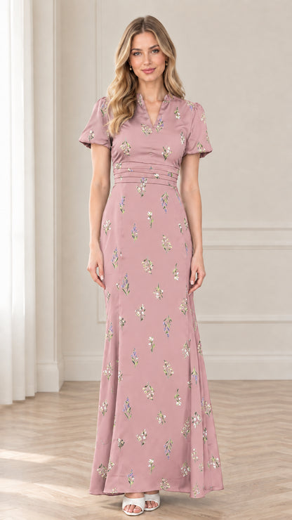 Front view of model wearing dusty pink floral print maxi evening dress