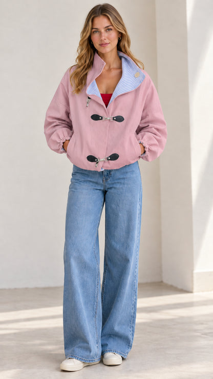 Front full-length view of the dusty pink toggle casual jacket paired with jeans