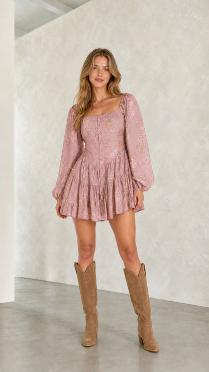 Model wearing pink floral mini dress