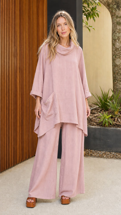 Model wearing dusty pink cowl neck tunic and wide leg pants set