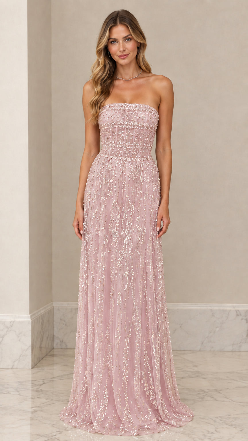 Front view of model wearing Blush Pink strapless beaded corset formal gown