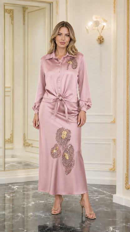 Model wearing pink satin sequined two-piece set
