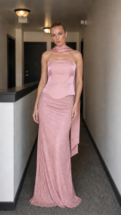 Model wearing pink evening gown set with corset bodice