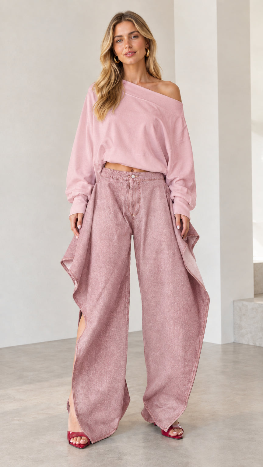 Full front view of monochromatic dusty pink draped wide-leg denim jeans and matching pink pullover