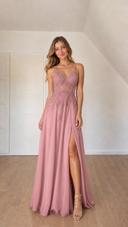 Front view of woman wearing dusty rose pink chiffon evening gown with lace bodice
