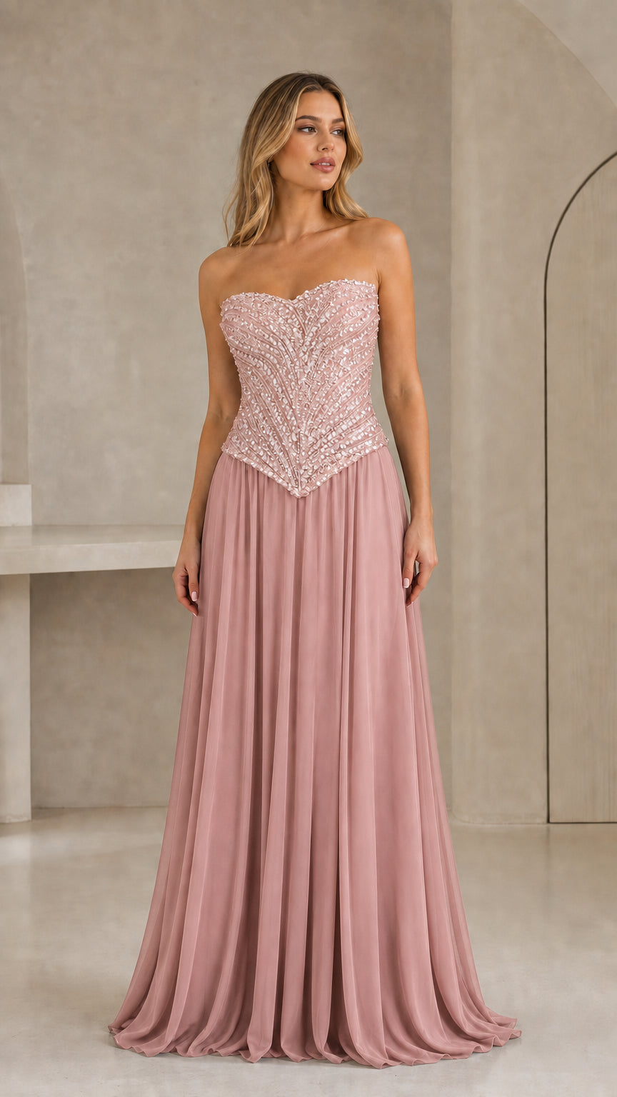 Full-length front view of dusty pink strapless sequin basque waist maxi gown