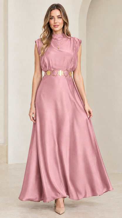 Model wearing blush pink mock neck satin maxi dress with gold belt