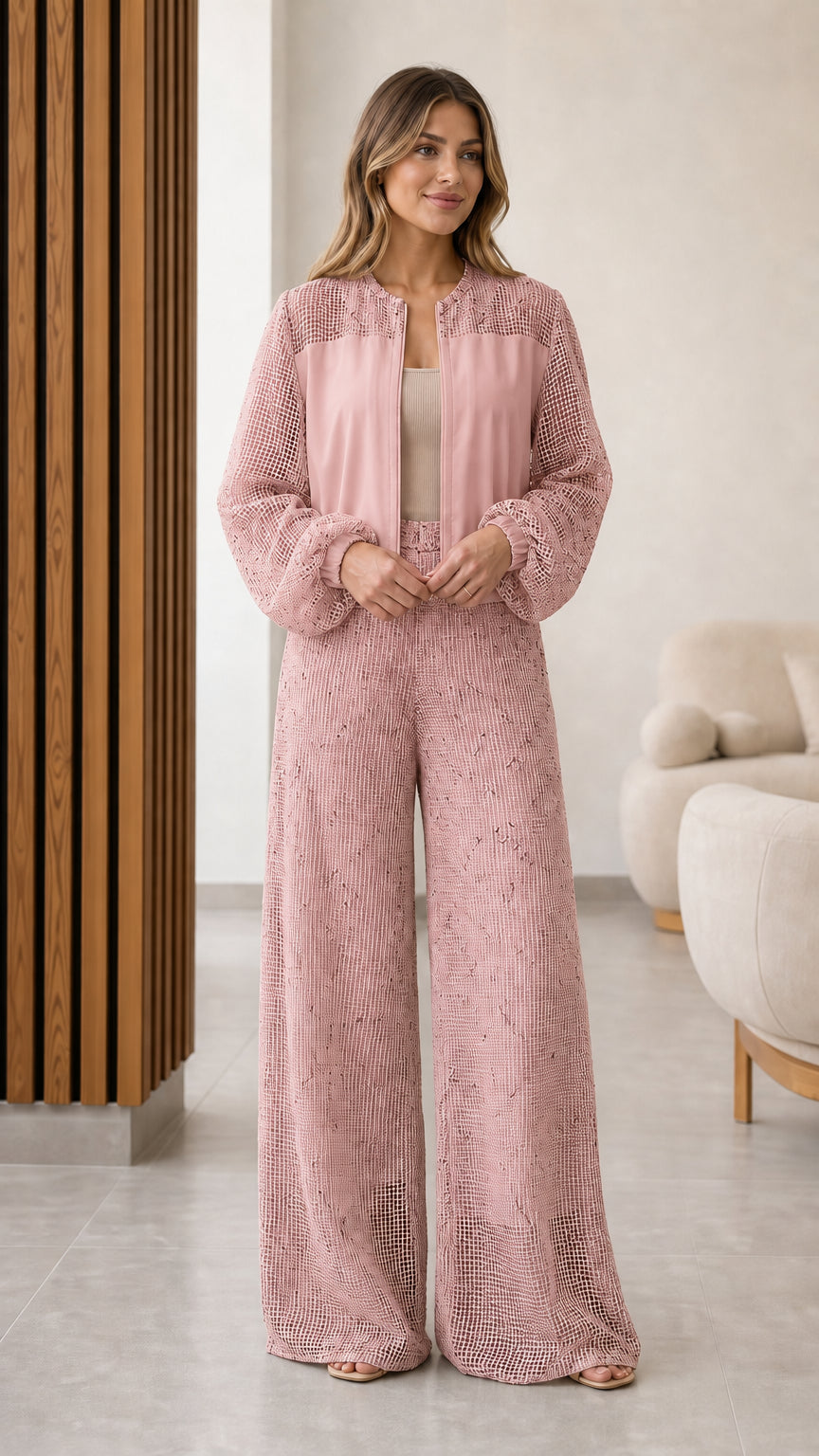 Model wearing dusty pink textured mesh panel zip jacket and wide leg pants set