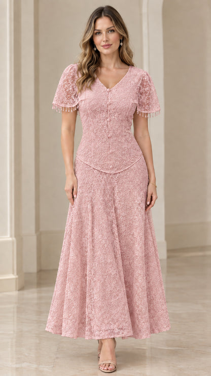 Front view of model in dusty pink floral lace V-neck maxi dress