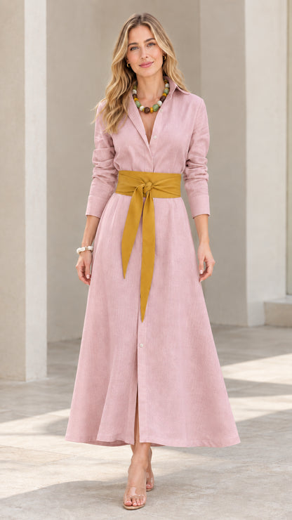 Front view of model wearing dusty pink long sleeve maxi shirt dress with yellow sash belt