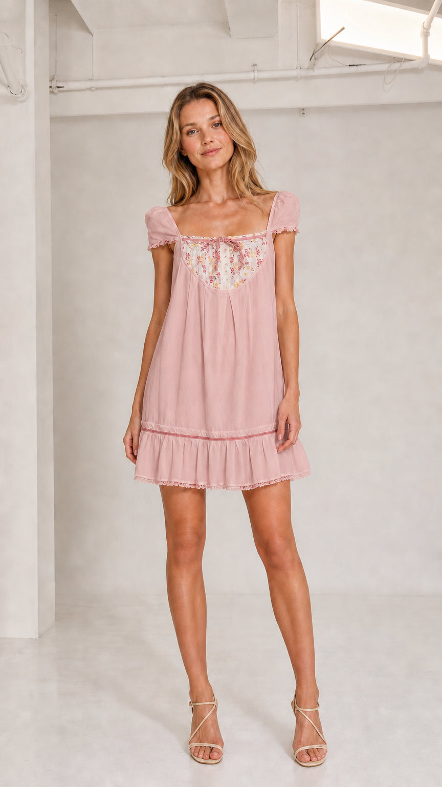 Blush pink floral bib babydoll mini dress front view