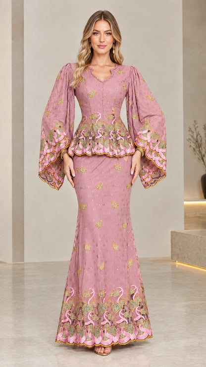 Front view of model wearing dusty pink embroidered peplum maxi dress set