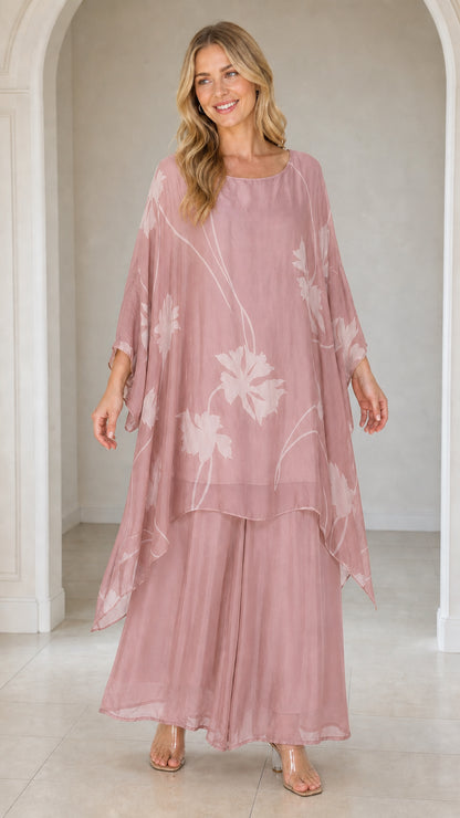 Front view of woman wearing dusty rose floral kaftan set