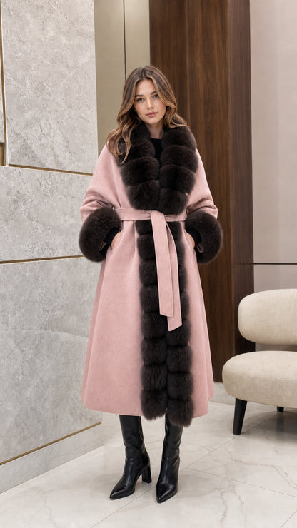 Front view of woman wearing the blush pink longline coat with dark fur trim