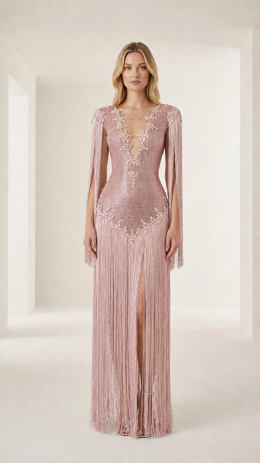 Front view of model wearing a pink crystal-embellished fringe evening gown