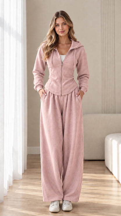 Front view of model wearing dusty pink corset hoodie and wide-leg sweatpants set
