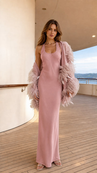 Model wearing dusty pink satin maxi dress and matching feather shrug