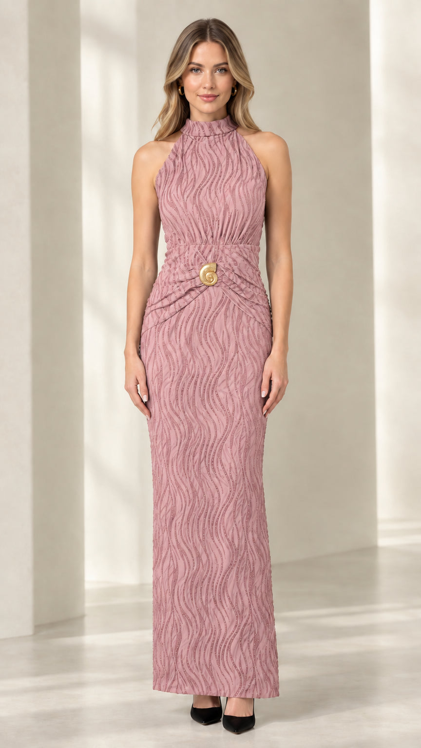 Front view of woman wearing mauve pink textured halter neck maxi dress